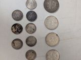 a lot of coins that are on the table