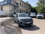 a car that is parked in front of a building