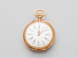 an antique gold pocket watch with roman numerals and roman numerals