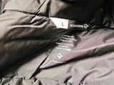 the jacket is black and has a white label on it