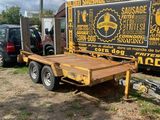 a truck that is parked next to a trailer