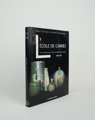 books on a white background with a black cover and a picture of vases