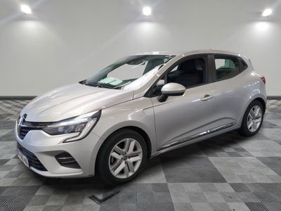 a silver car is parked on a checkered floor in a garage