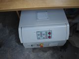 a machine that is sitting under a table
