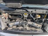 the engine of a car with its hood open and the hood down