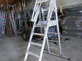 a ladder that is leaning against a wall in a garage