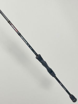 a close up of a fishing rod on a white surface