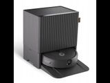 une image montrant un gros plan d'une enceinte noire posée sur une surface blanche