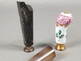 two vases that are next to each other on a table