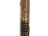 a close up of a wooden stick with a cat head on it