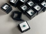 a lot of small black and white boxes with green eyes