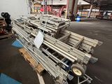 a large pile of metal pipes sitting in a warehouse