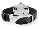 a watch that is sitting on top of a black leather strap