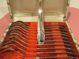 silverware in a box with forks and spoons in it