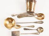 a lot of silver spoons and spoon spoons on a white surface