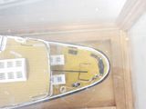 a model of a boat on display in a glass case