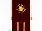 an image of a red and gold flag with a sun on it