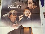 a poster of a movie with a man holding a baby