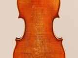 an old violin with a wooden back and a long neck