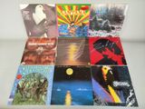 a bunch of records are sitting on top of a table