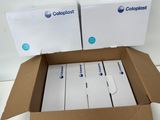 two boxes of white and blue colored paper are stacked on top of each other