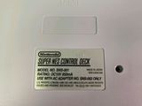 a close up of a nintendo super nes control deck