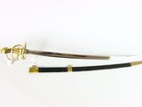 two swords on a white surface with a gold and black handle