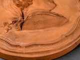 a clay sculpture of a woman with a horse on it