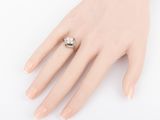 an image of a woman ' s hand with a ring on it ' s finger