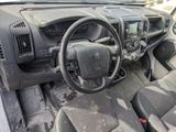 a dashboard of a car with a steering wheel and dashboard controls