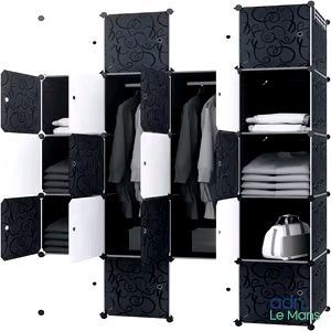 une armoire noire et blanche sur laquelle sont posés des vêtements