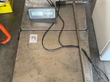 an image of a scale sitting on the floor