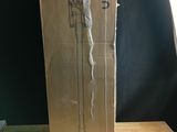 a cardboard box on a table with a pair of shoes