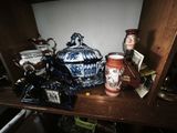 a shelf that has many different vases and jars on it
