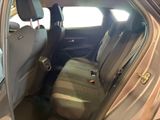 the back seat of a car with the door open and a seat belt down