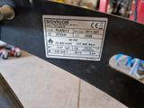 a close up of a metal object with a label on it
