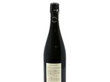 a bottle of wine sitting on top of a white table
