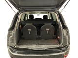 two seats in the back of a car with the trunk open