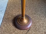 a lamp that is sitting on the floor in the room