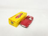 an image of a red toy car next to a yellow box