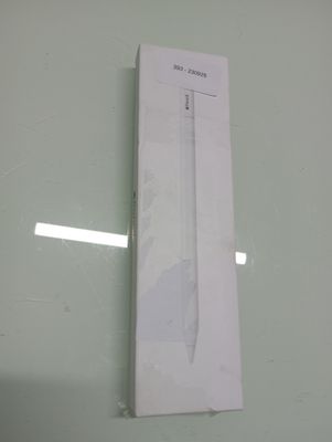 a white box on the wall with a pen in it