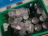 many empty beer bottles in a green crate
