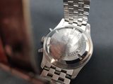 a close up of a watch on a table