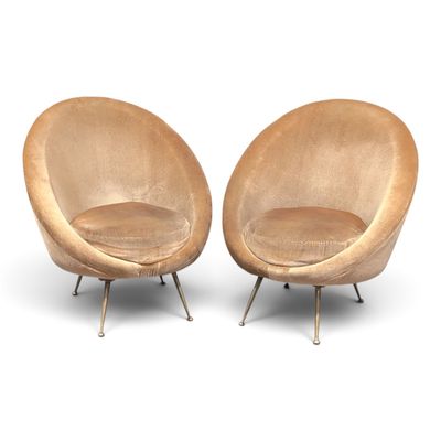pair of mid - century modern lounge chairs in the style of eero