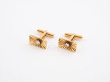 a pair of gold and diamond cufflinks