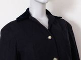 black wool coat with gold buttons on a mannequin mannequin mannequin mannequin mannequin mannequin mannequin mannequin
