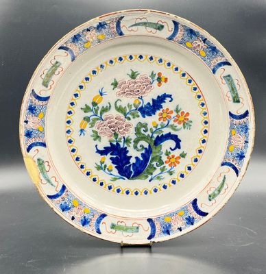 a close up of a plate with flowers on it