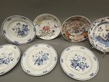 six blue and white plates with floral designs on them on a table