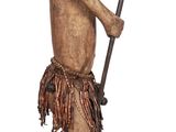 wooden statue of a man with a spear and a hat