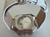 a watch that is on display on a table
